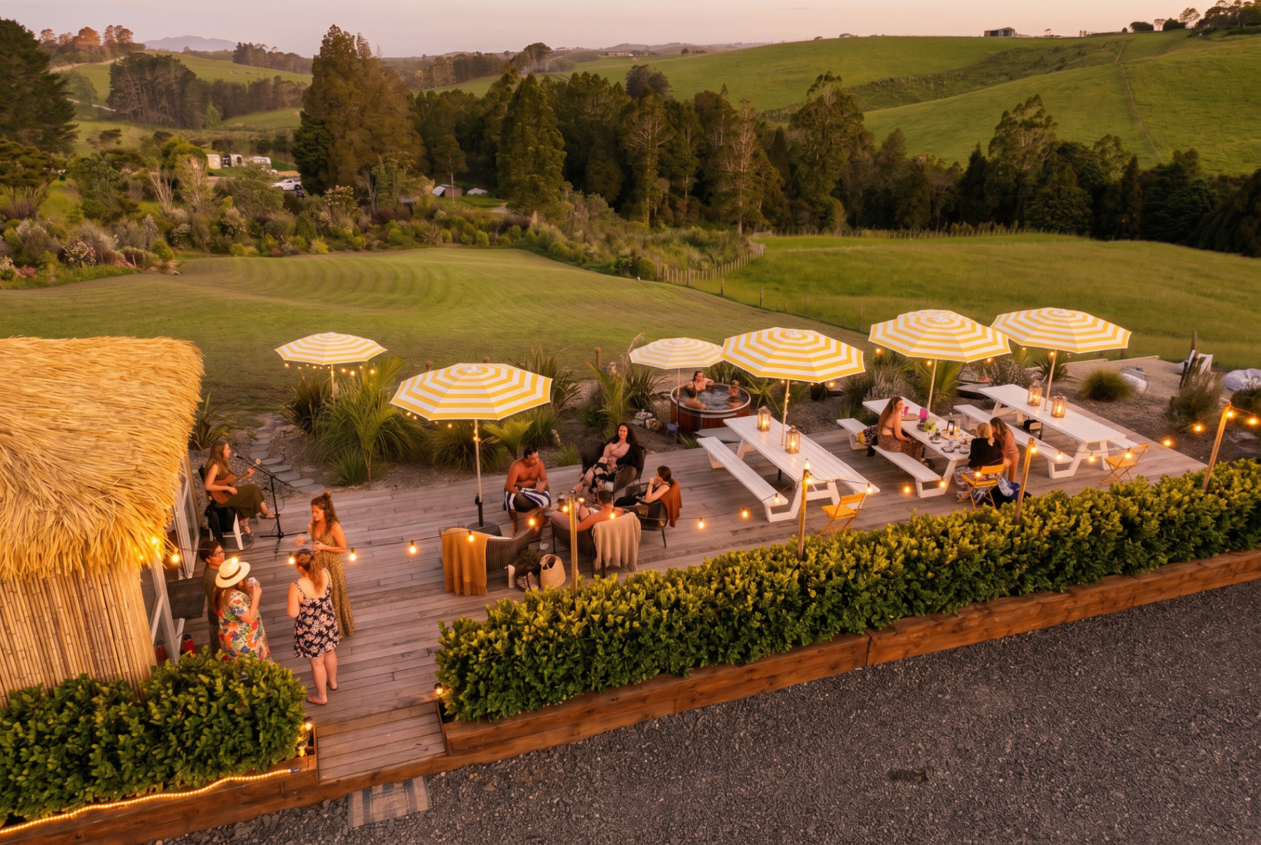 Sauna, hot tubs and fire pit in the garden at Tiki Beach, Mangawhai